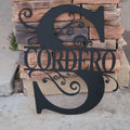 Metal monogram sign close-up, plasma-cut lettering detail