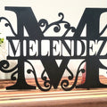 Split monogram sign detail showing regal font cut design