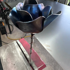 Metal rose close-up showing hand-finished petal detail