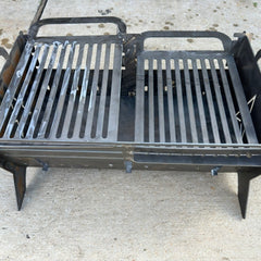 Collapsible fire pit assembled and lit outdoors