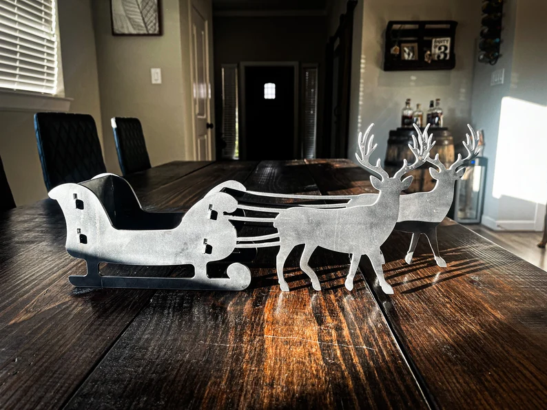 Metal Christmas sleigh and reindeer silhouette, steel holiday decor